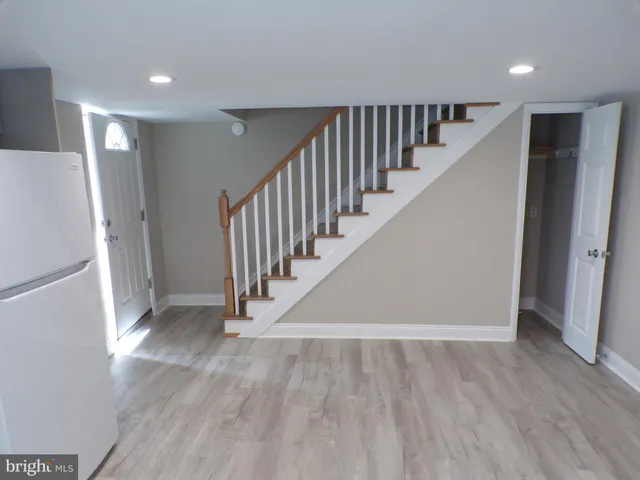 a view of a hallway with staircase
