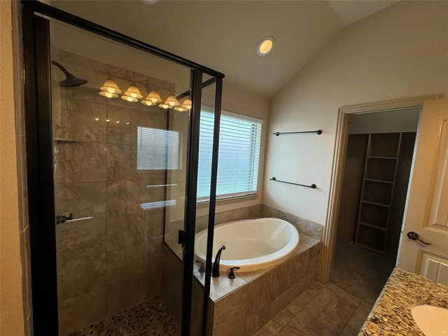 a bathroom with a sink and shower