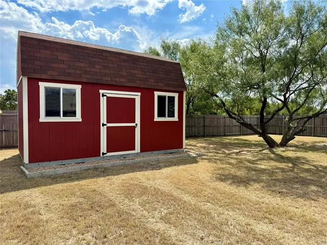 a view of house with yard