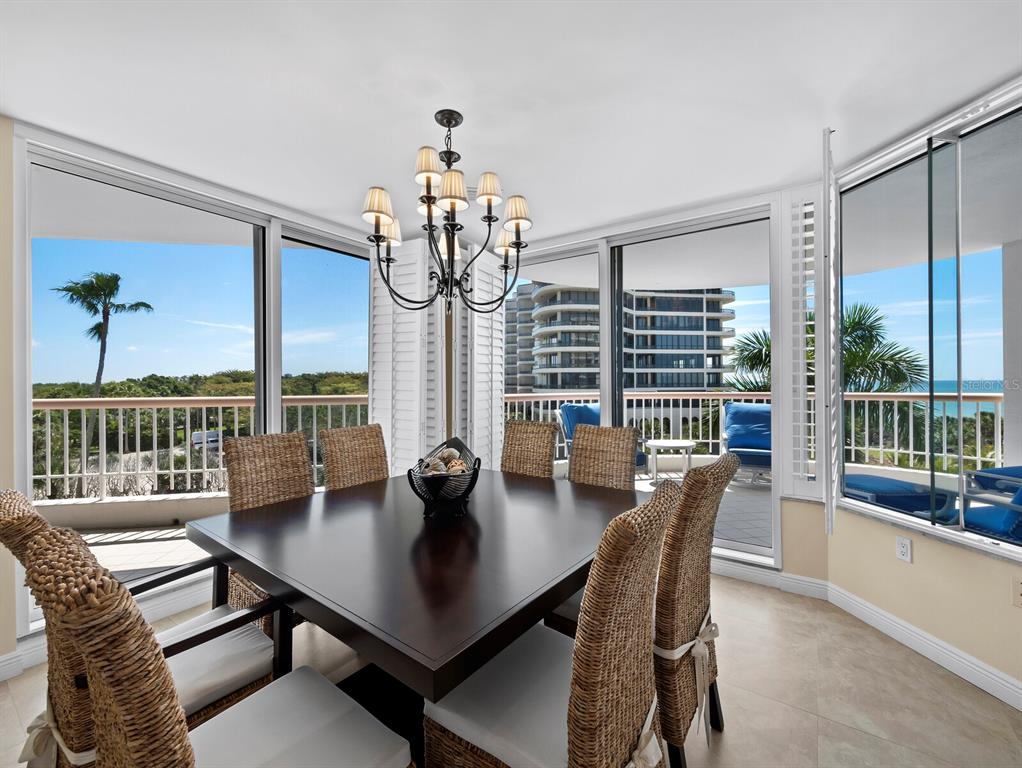 455 Longboat Club Road, Unit 402 Longboat Key, FL 34228 - Photo 5 of 48 a view of a dining room with furniture window and outside view