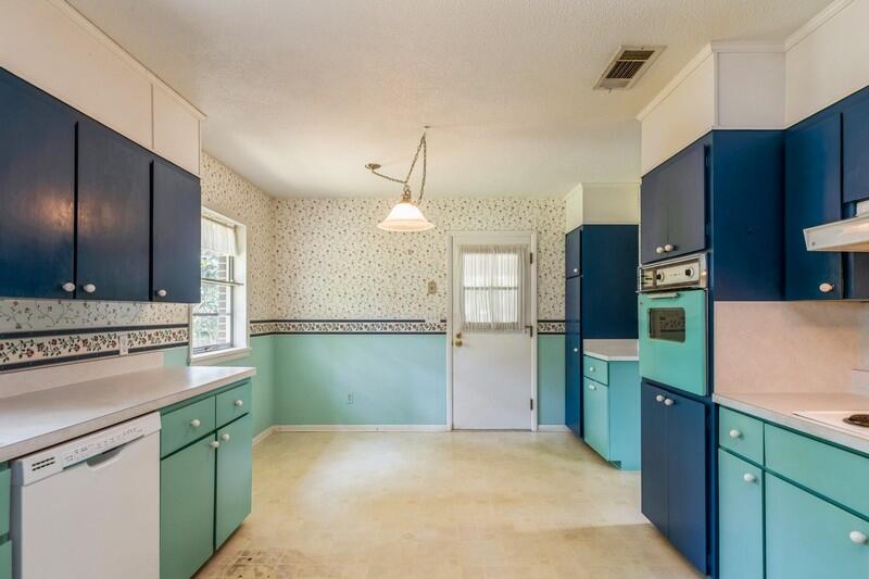 349 Powell Drive Crestview, FL 32536 - Photo 11 of 30 a kitchen with cabinets and stainless steel appliances