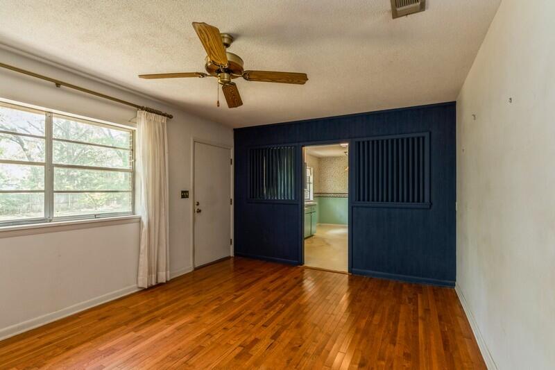 349 Powell Drive Crestview, FL 32536 - Photo 15 of 30 a view of an empty room with wooden floor and a window