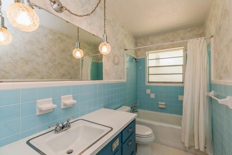 349 Powell Drive Crestview, FL 32536 - Photo 18 of 30 a bathroom with a sink a toilet and a mirror