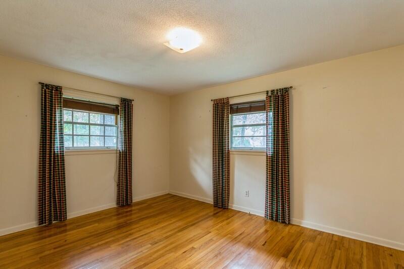 349 Powell Drive Crestview, FL 32536 - Photo 27 of 30 a view of an empty room with wooden floor and a window