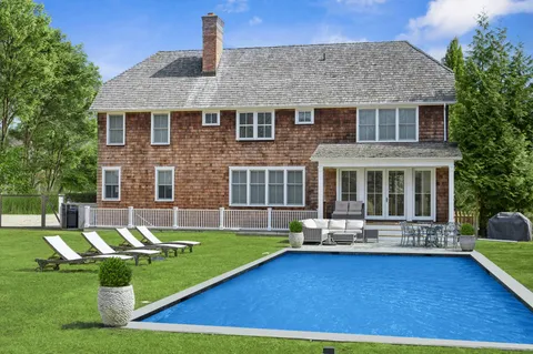 a view of a house with a swimming pool
