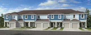 2097 Hallier Cove Wesley Chapel, FL 33543 - Photo 1 of 1 a front view of a residential apartment building with a yard