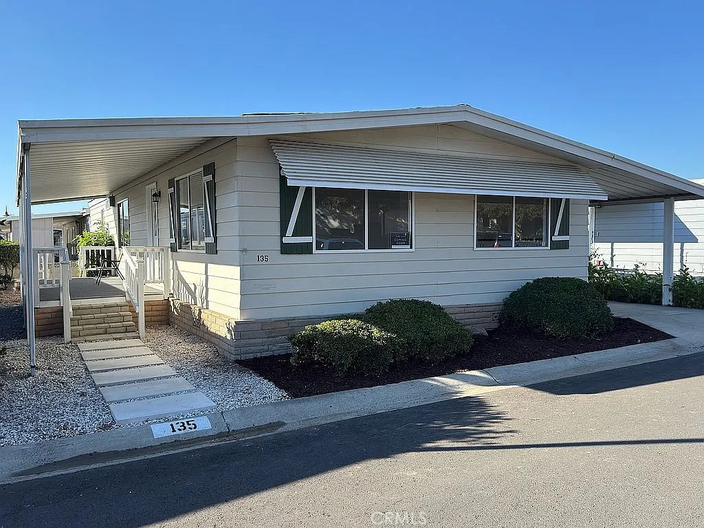 14851 Jeffrey Road, Unit 135 Irvine, CA 92618 - Photo 1 of 17 a front view of a house with garden