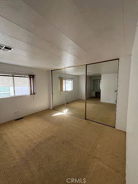 14851 Jeffrey Road, Unit 135 Irvine, CA 92618 - Photo 14 of 17 a view of empty room with windows