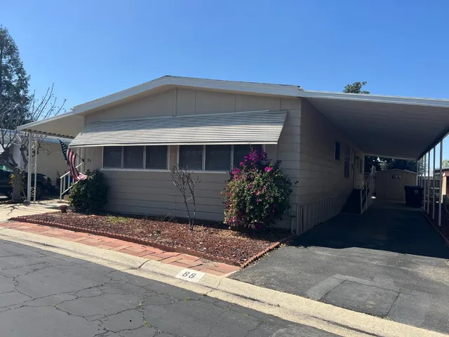 a front view of a house with a garage