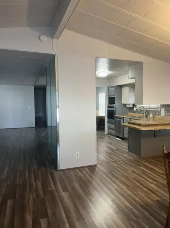 a view of kitchen with wooden floor