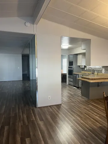 a view of kitchen with wooden floor