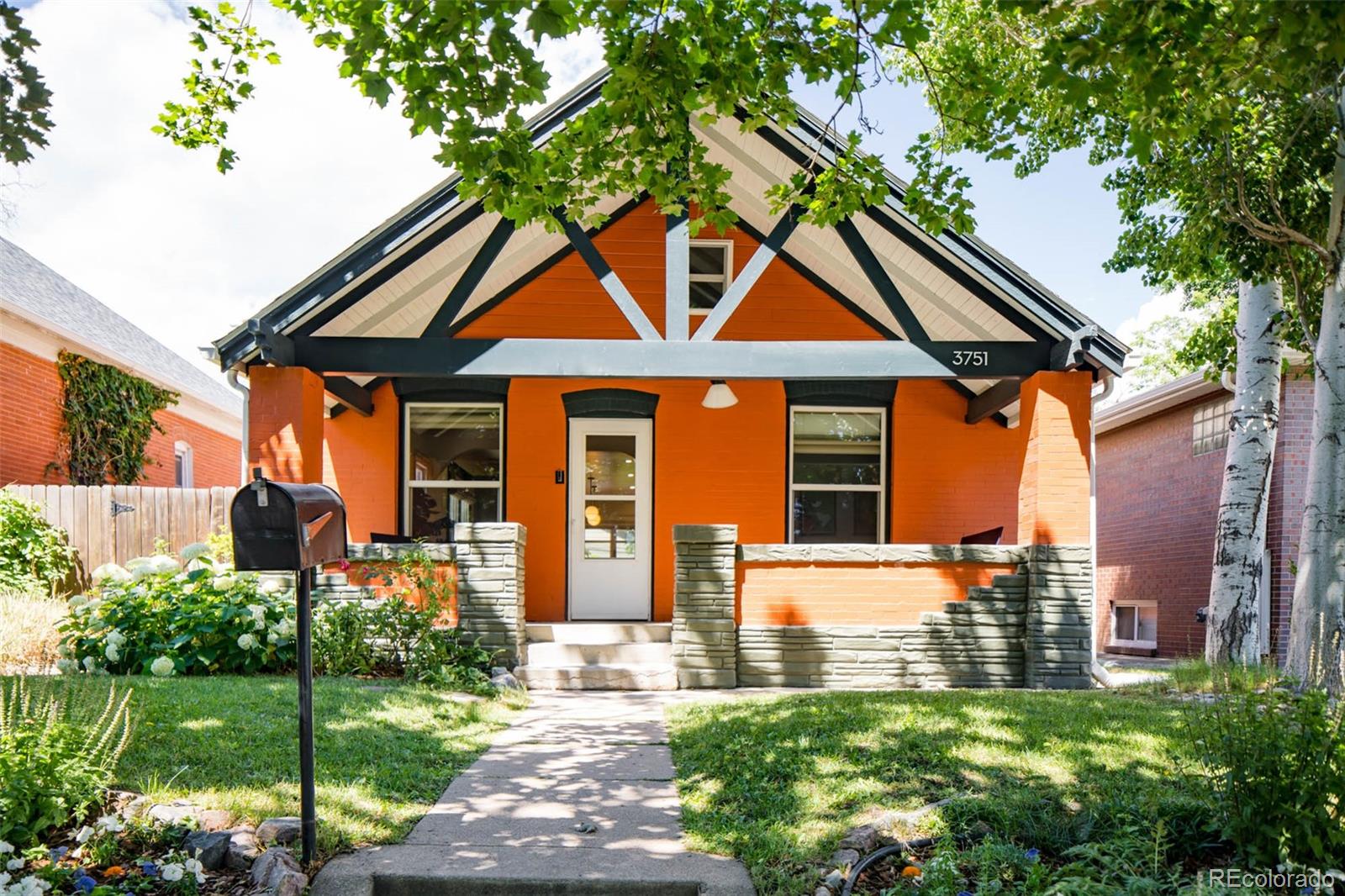3751 Raleigh Street Denver, CO 80212 - Photo 1 of 36 a front view of a house with garden