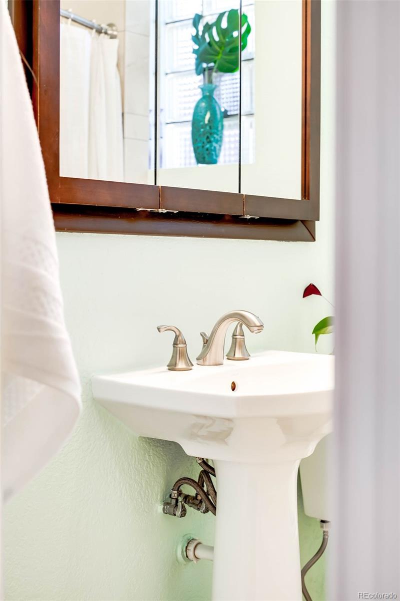 3751 Raleigh Street Denver, CO 80212 - Photo 13 of 36 a bathroom with a sink and a mirror
