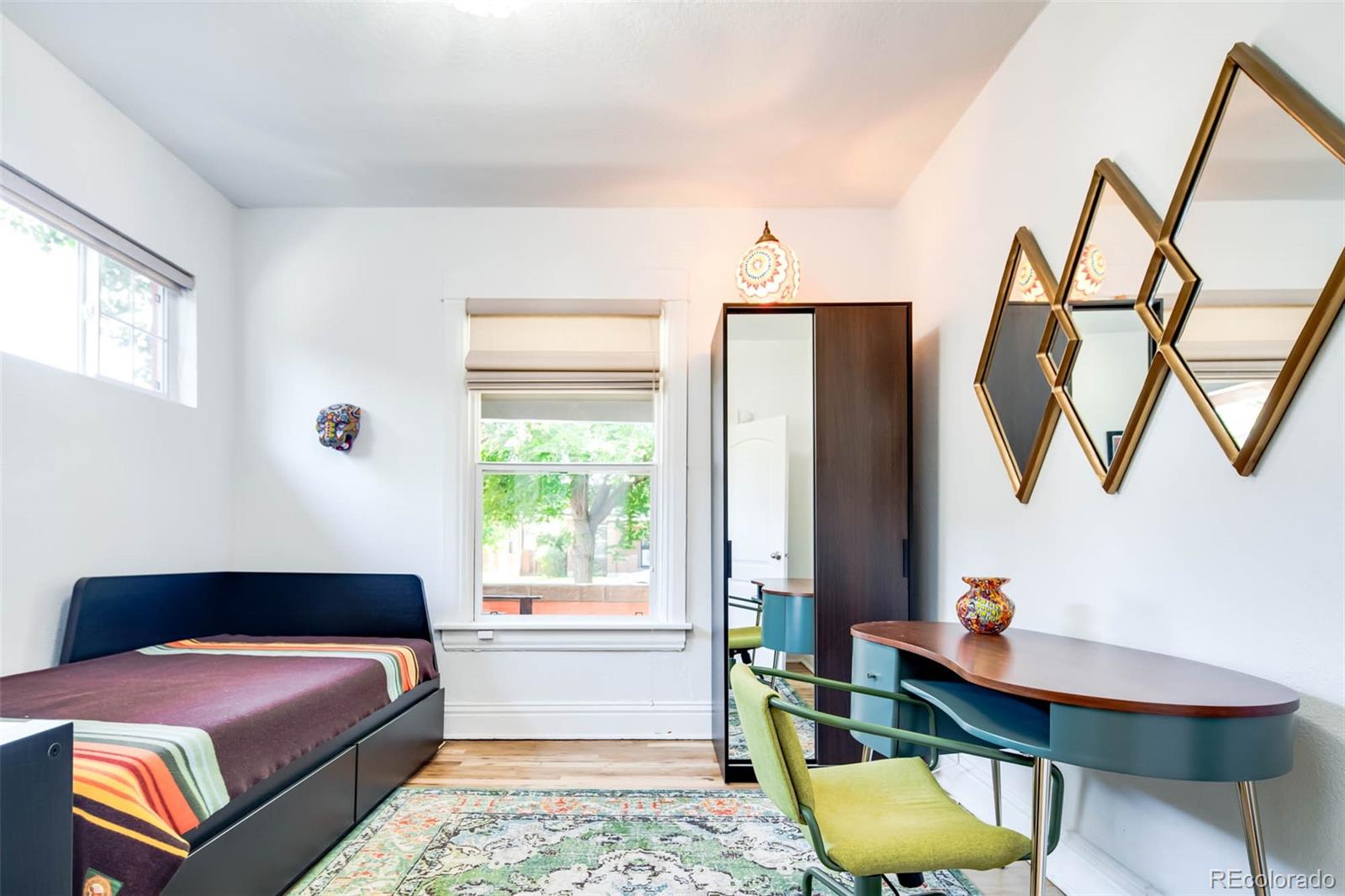 3751 Raleigh Street Denver, CO 80212 - Photo 15 of 36 a bedroom with a bed and a window