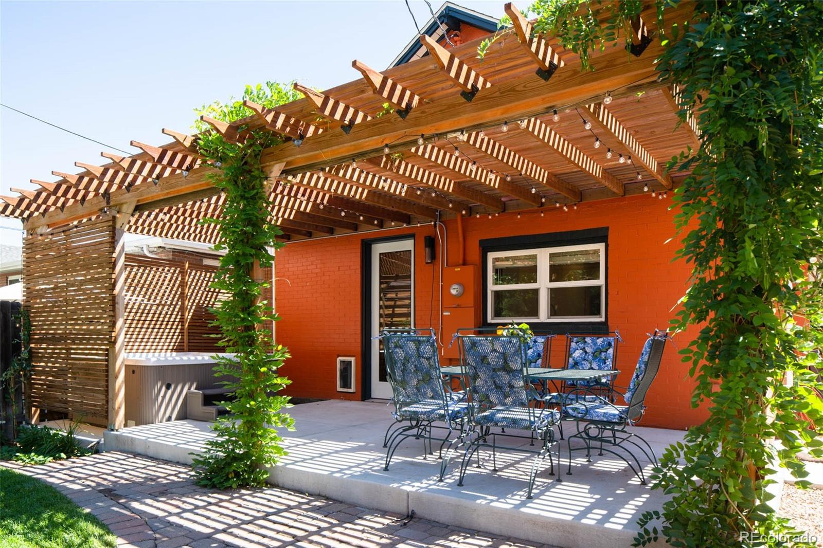 3751 Raleigh Street Denver, CO 80212 - Photo 17 of 36 a table and chairs in front of house