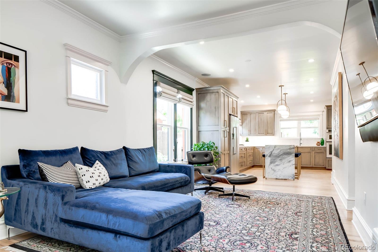 3751 Raleigh Street Denver, CO 80212 - Photo 3 of 36 a living room with furniture and a rug
