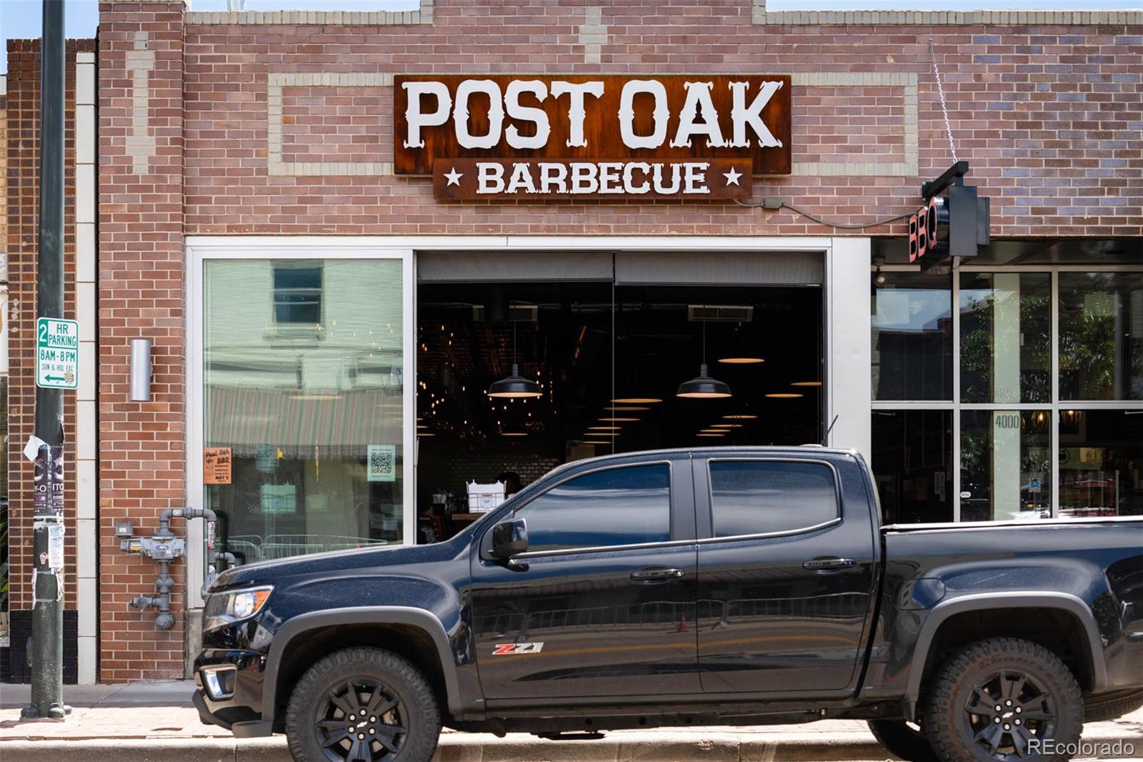 3751 Raleigh Street Denver, CO 80212 - Photo 34 of 36 a front view of a building with parking space and entrance