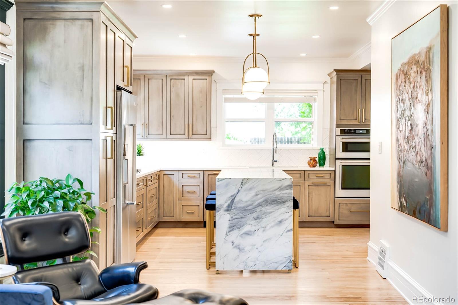 3751 Raleigh Street Denver, CO 80212 - Photo 4 of 36 a kitchen with stainless steel appliances granite countertop a refrigerator and a sink