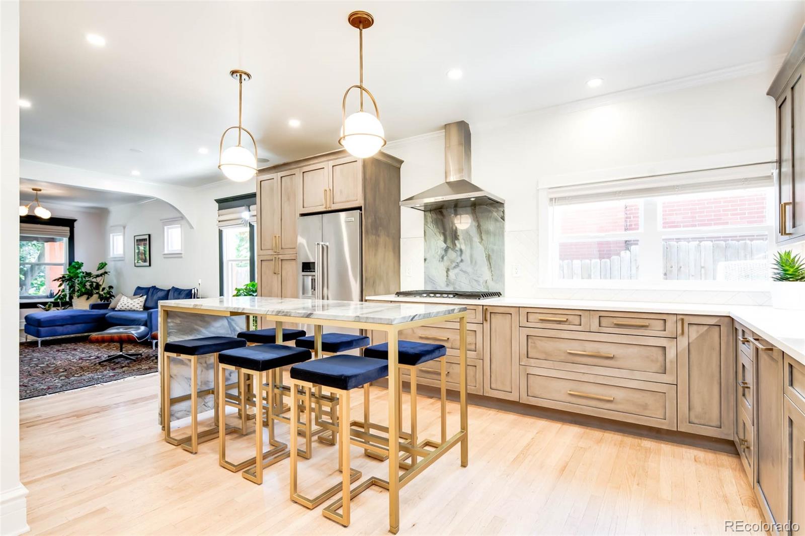 3751 Raleigh Street Denver, CO 80212 - Photo 8 of 36 a kitchen with stainless steel appliances kitchen island granite countertop a sink and a cabinets