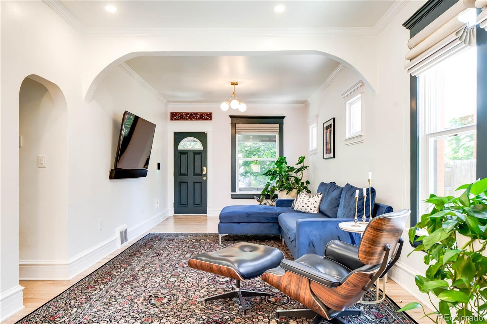 3751 Raleigh Street Denver, CO 80212 - Photo 10 of 36 a living room with furniture and a potted plant