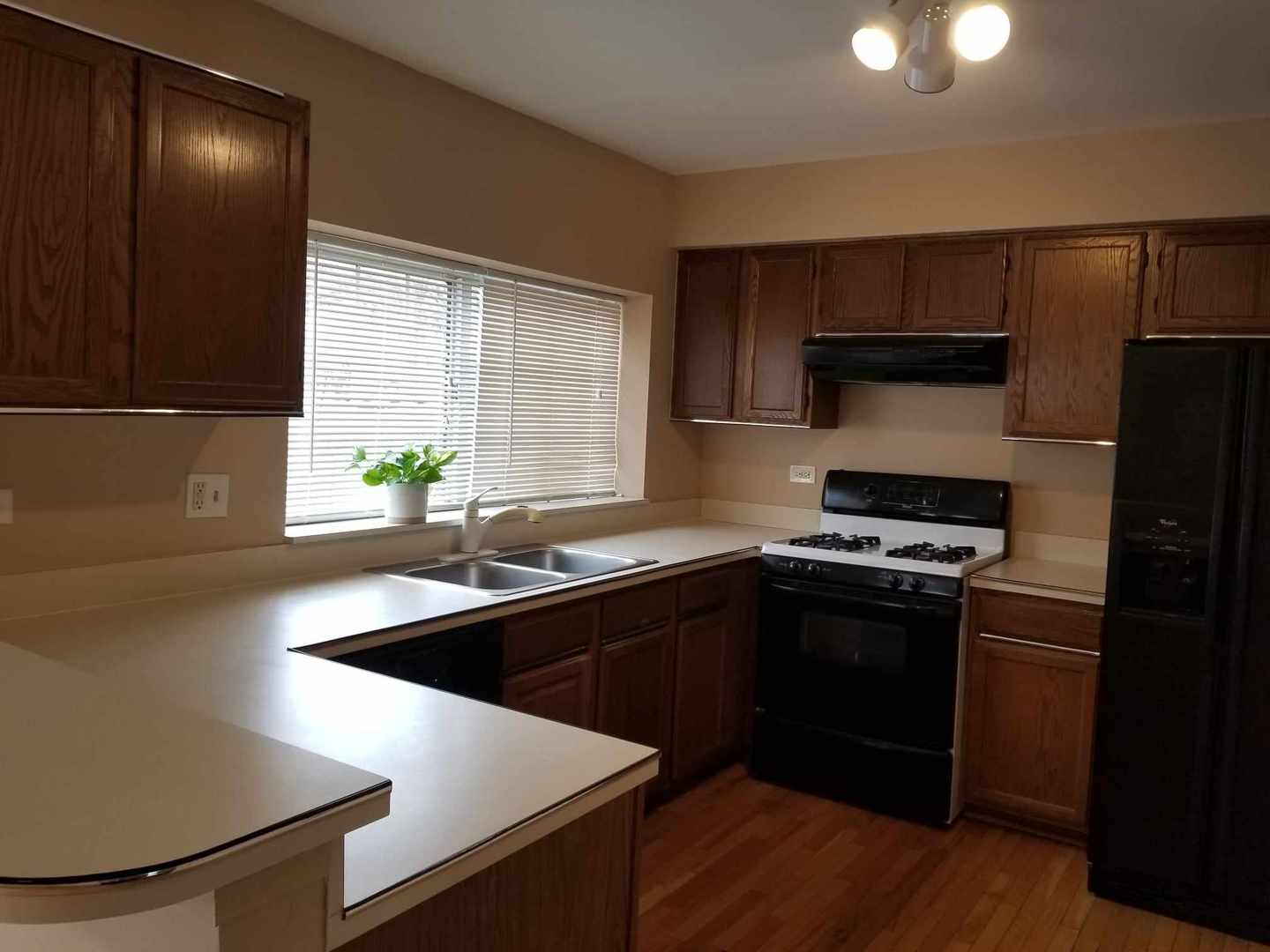 7 North Oltendorf Road Streamwood, IL 60107 - Photo 15 of 31 a kitchen with granite countertop a sink cabinets and stainless steel appliances