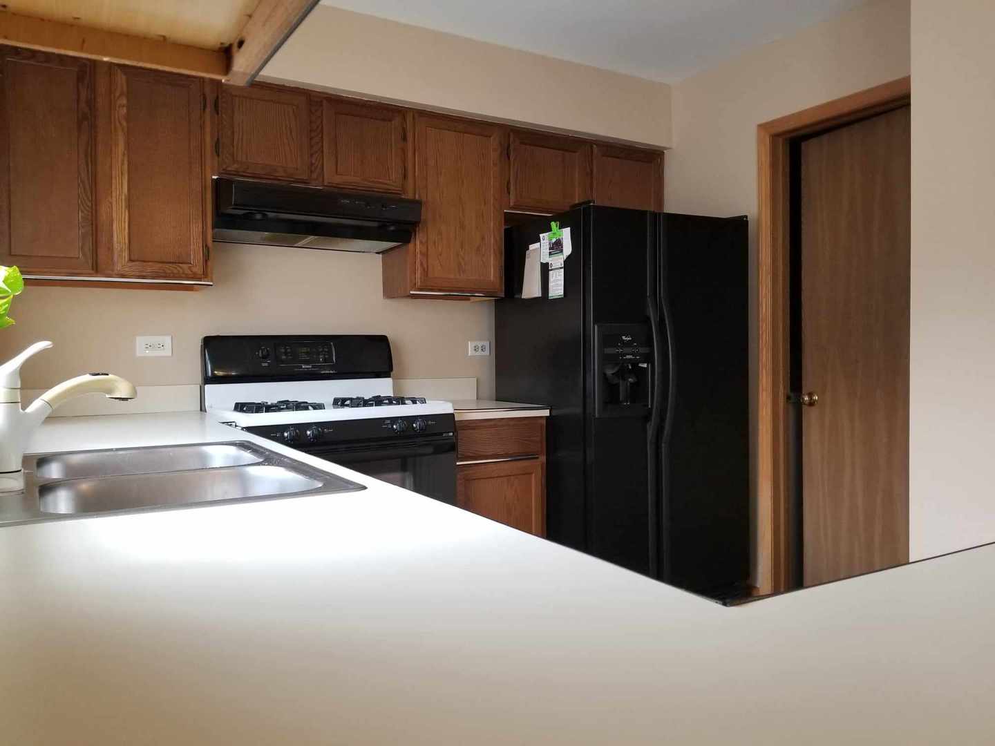 7 North Oltendorf Road Streamwood, IL 60107 - Photo 17 of 31 a kitchen with a refrigerator and a sink