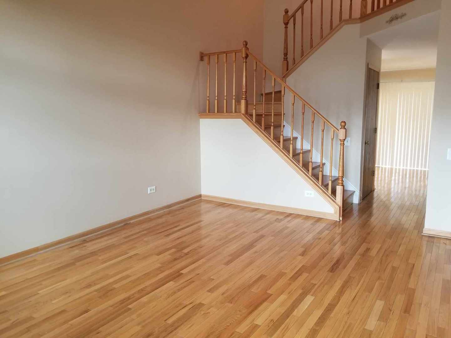 7 North Oltendorf Road Streamwood, IL 60107 - Photo 7 of 31 a view of staircase with wooden floor and white walls