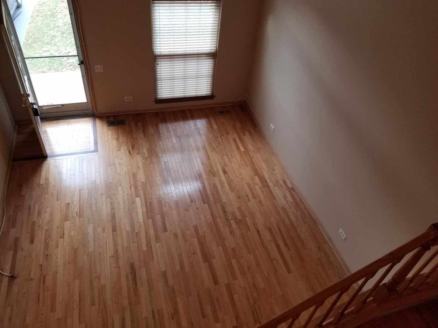 7 North Oltendorf Road Streamwood, IL 60107 - Photo 10 of 31 an empty room with wooden floor and windows