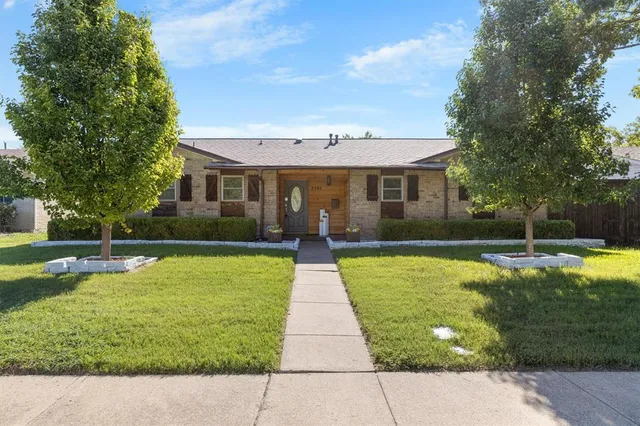 a view of a house with swimming pool and a yard