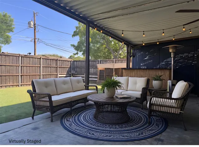 a outdoor living space with furniture and a fireplace