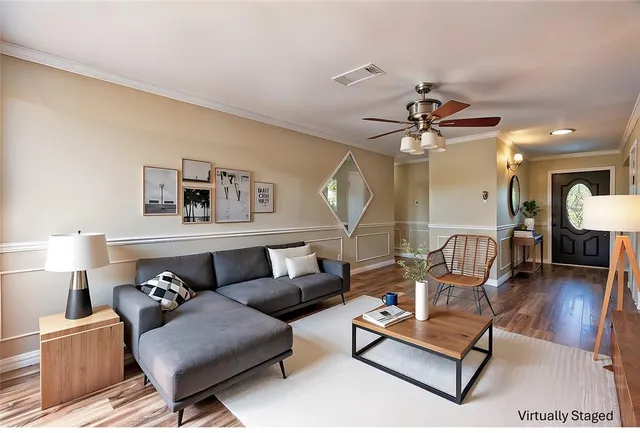 a living room with furniture and a lamp