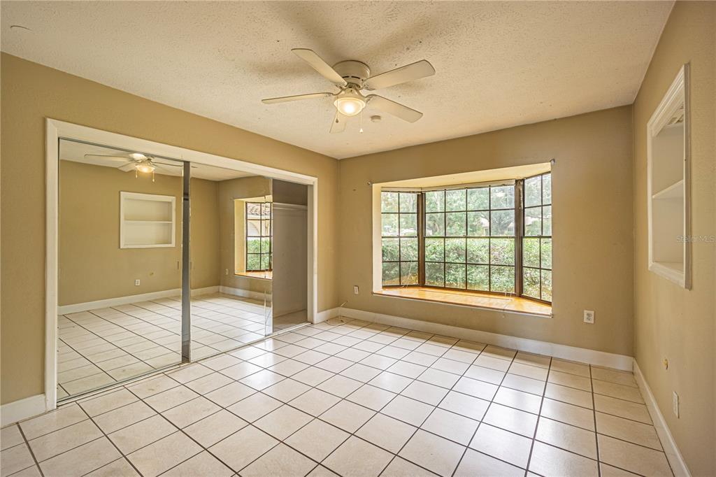 18129 Crawley Road Odessa, FL 33556 - Photo 12 of 46 a view of an empty room with window