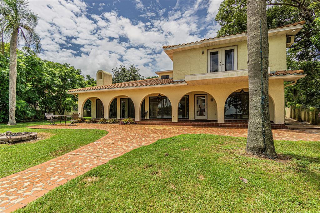 18129 Crawley Road Odessa, FL 33556 - Photo 5 of 46 a view of a house with backyard and garden