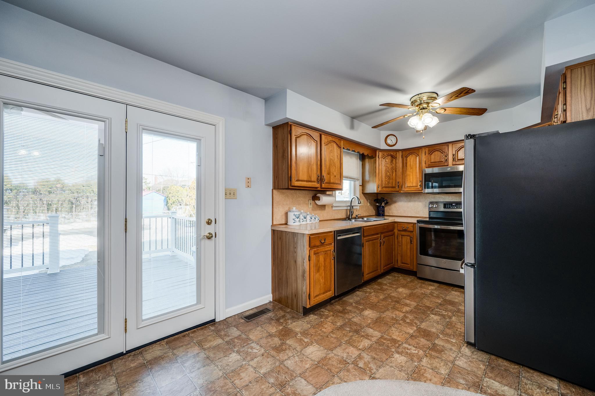 523 Mount Laurel Road Temple, PA 19560 - Photo 16 of 36 a kitchen with a refrigerator a stove top oven a sink and dishwasher