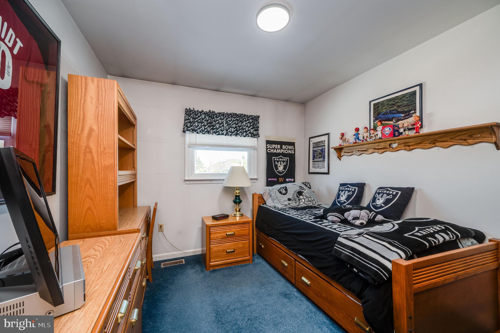 523 Mount Laurel Road Temple, PA 19560 - Photo 25 of 36 a bed room with furniture and a flat screen tv