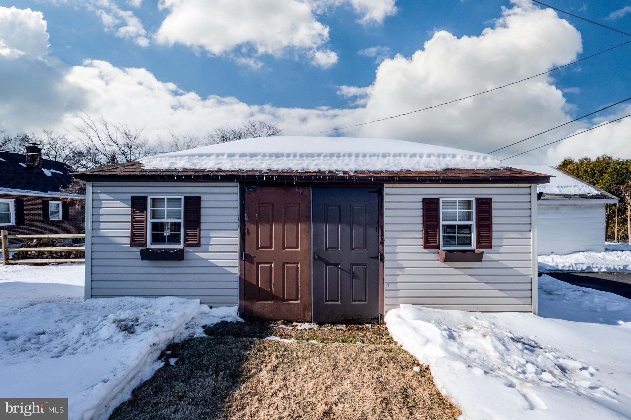 523 Mount Laurel Road Temple, PA 19560 - Photo 33 of 36 a front view of a house with a yard