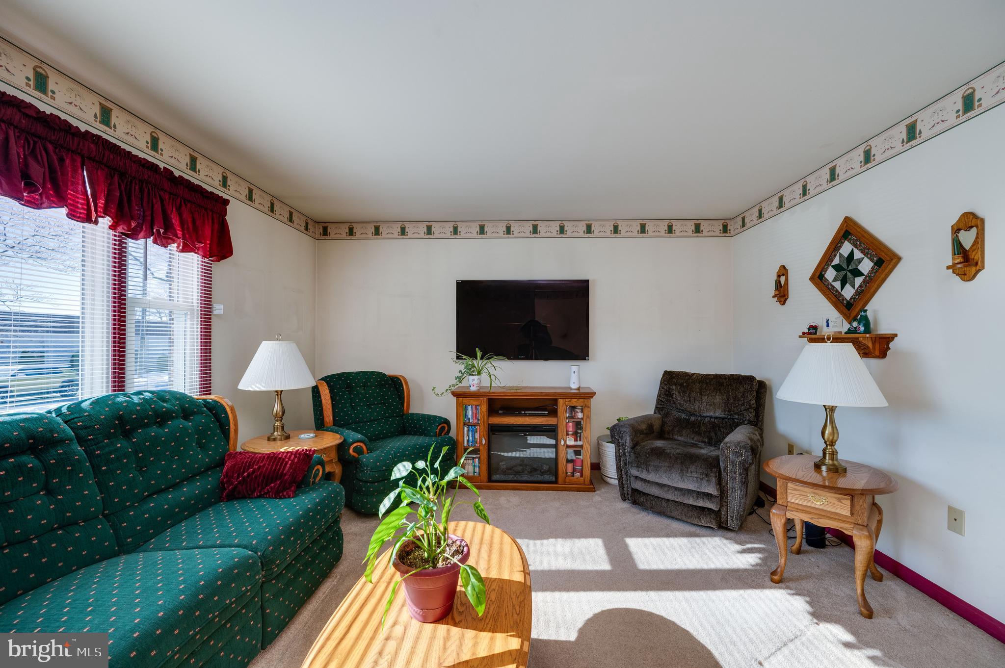 523 Mount Laurel Road Temple, PA 19560 - Photo 9 of 36 a living room with furniture and a flat screen tv