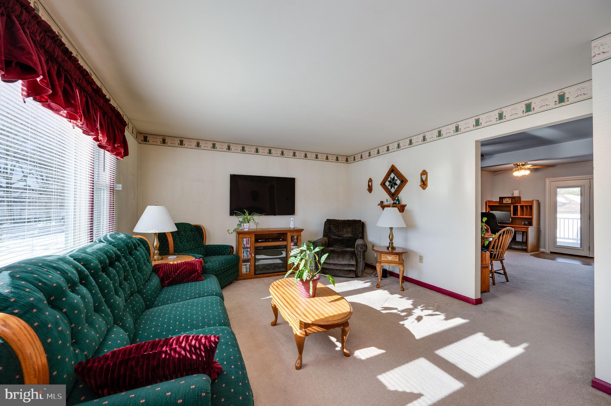 523 Mount Laurel Road Temple, PA 19560 - Photo 10 of 36 a living room with furniture and a flat screen tv