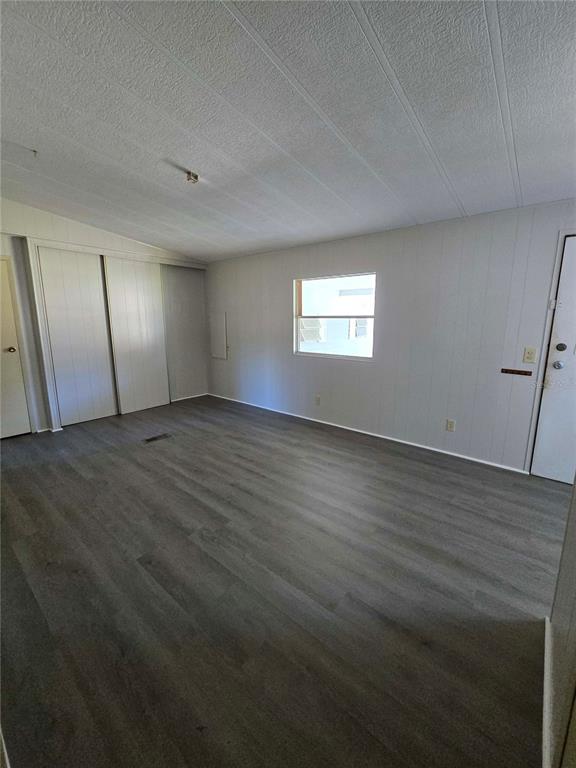 1991 Southeast 170th Avenue Road Silver Springs, FL 34488 - Photo 5 of 18 an empty room with wooden floor and windows