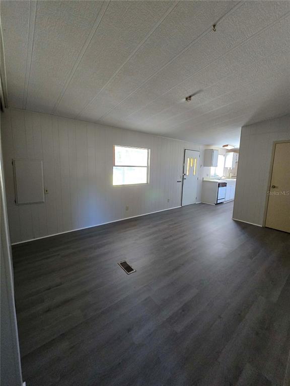 1991 Southeast 170th Avenue Road Silver Springs, FL 34488 - Photo 6 of 18 an empty room with wooden floor and windows