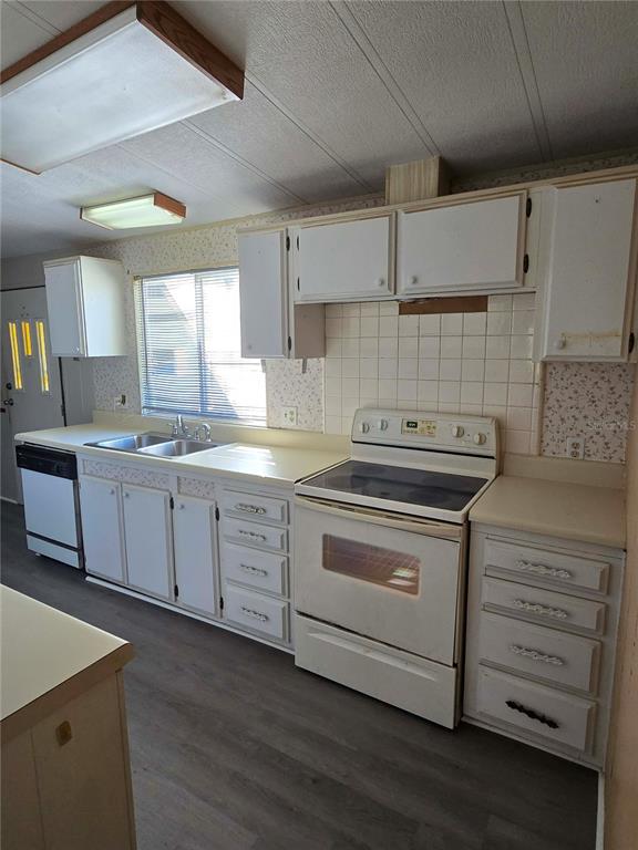 1991 Southeast 170th Avenue Road Silver Springs, FL 34488 - Photo 8 of 18 a kitchen with a stove cabinets and wooden floor