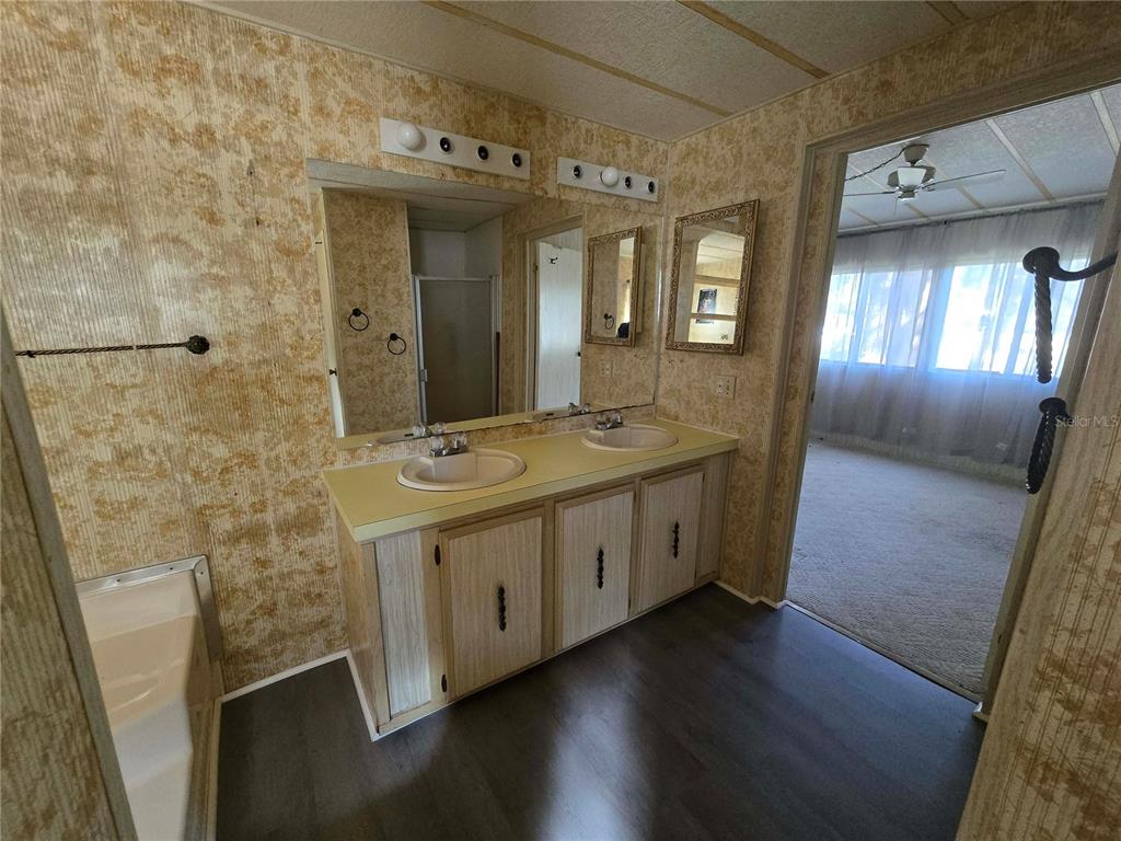 1991 Southeast 170th Avenue Road Silver Springs, FL 34488 - Photo 10 of 18 a bathroom with a double vanity sink and mirror