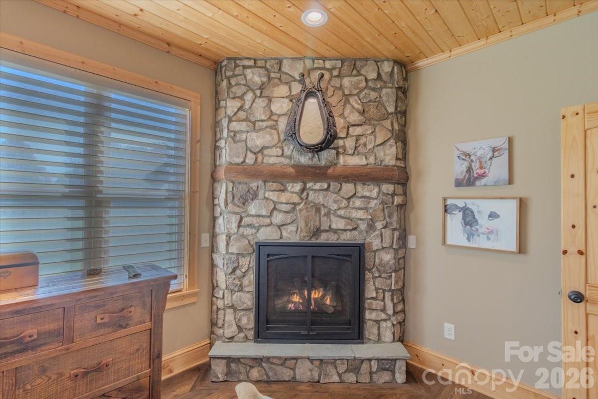 1083 Union Community Road Thurmond, NC 28683 - Photo 16 of 47 a fireplace with a wooden floor