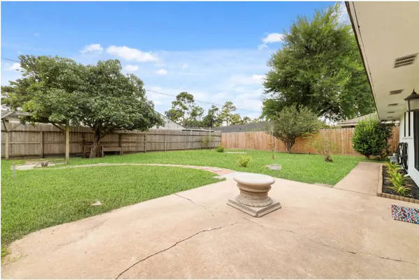 a view of a garden with a slide and a lake view