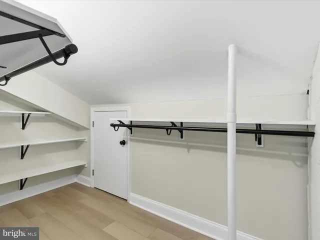 a view of a room with racks on the wall