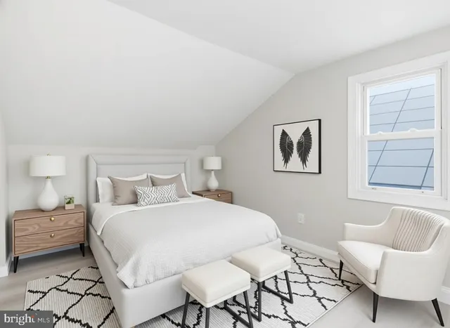 a bedroom with a bed and chair