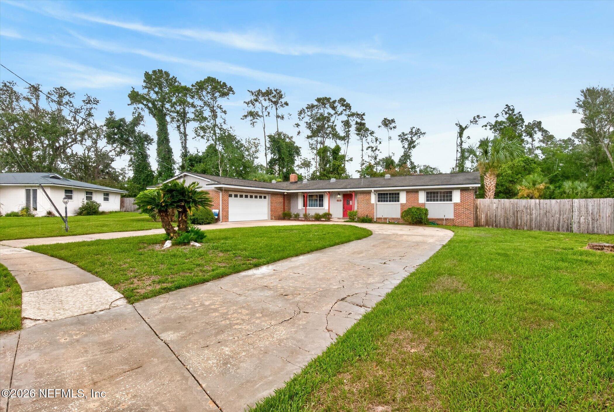 2705 Navajo Road Orange Park, FL 32073 - Photo 3 of 58 a view of a house with a yard