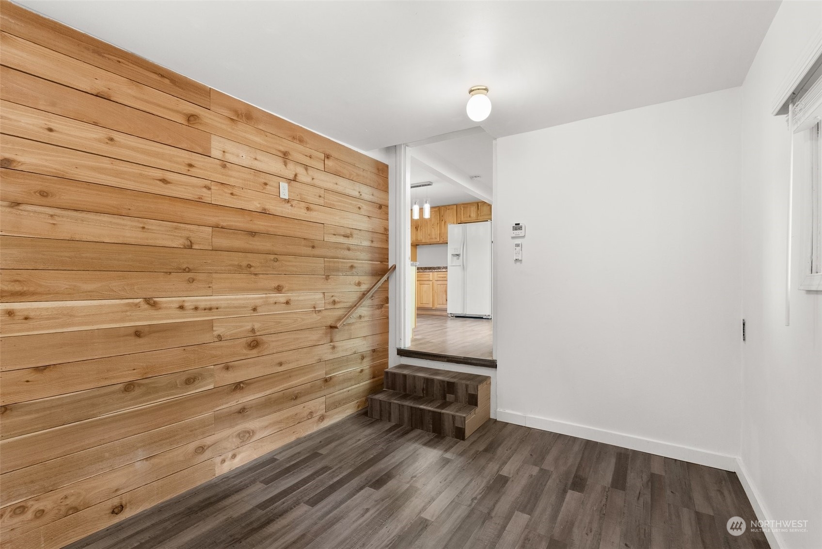 360 Highway 7 Morton, WA 98356 - Photo 12 of 23 a view of wooden floor and chair in a room