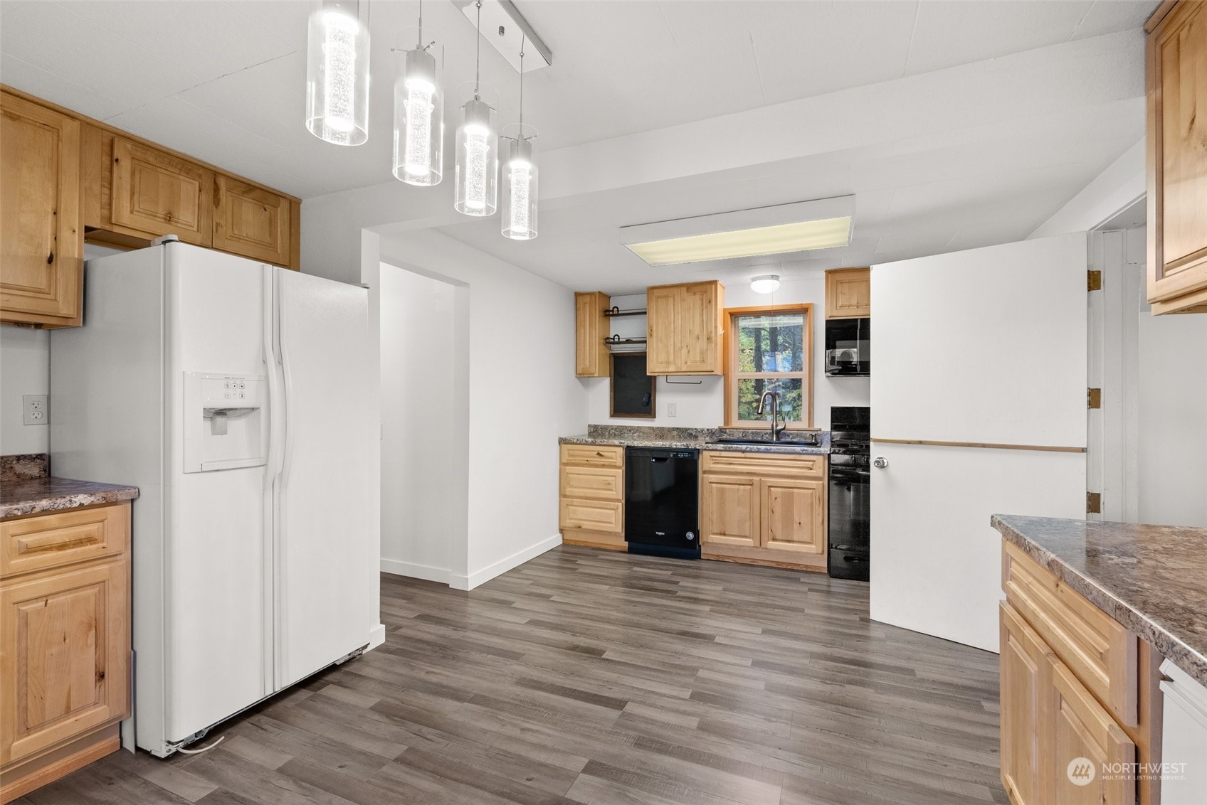 360 Highway 7 Morton, WA 98356 - Photo 10 of 23 a kitchen with granite countertop a refrigerator and a stove