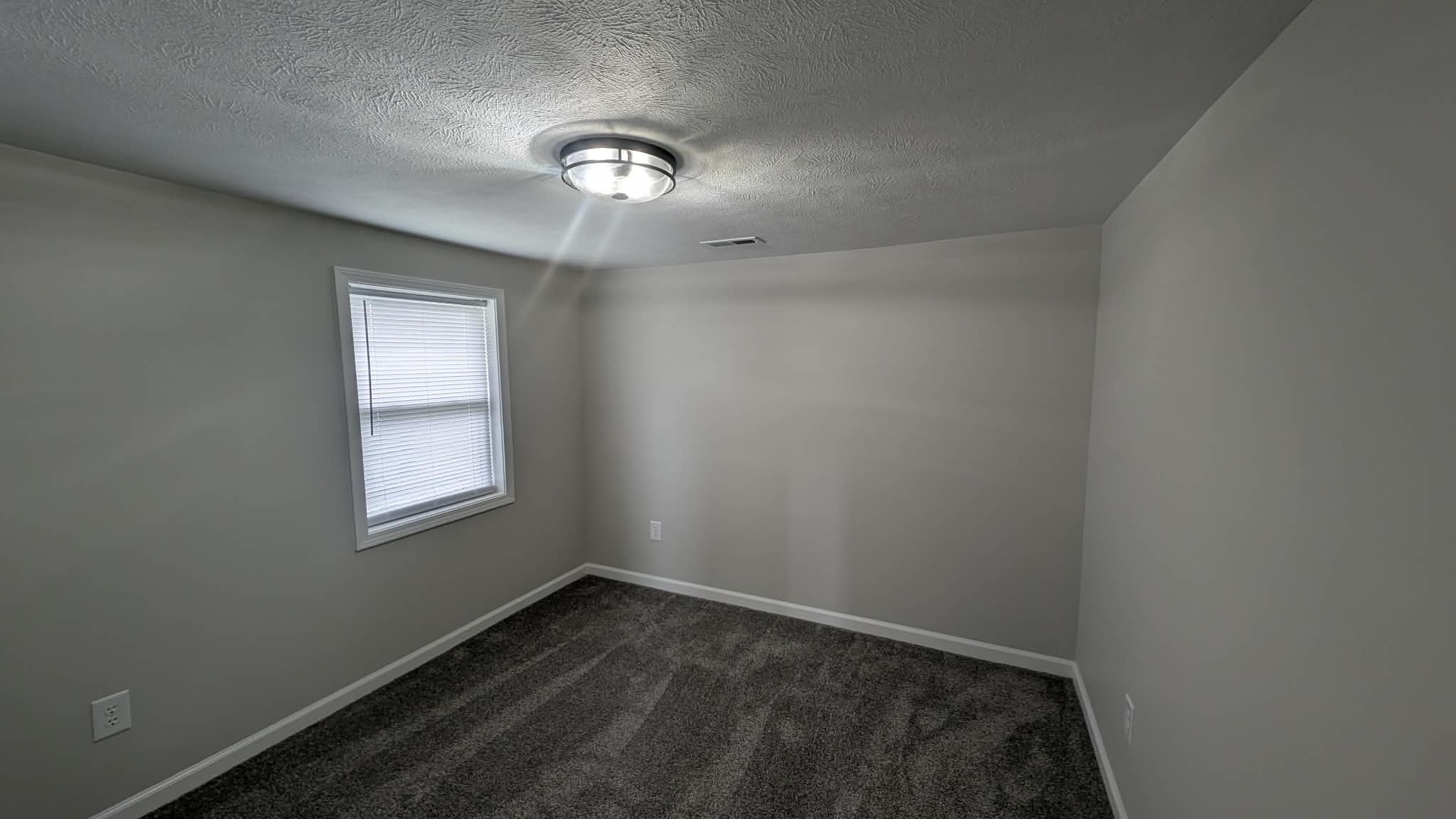 720 East Marion Street Clinton, IL 61727 - Photo 15 of 22 an empty room with a window